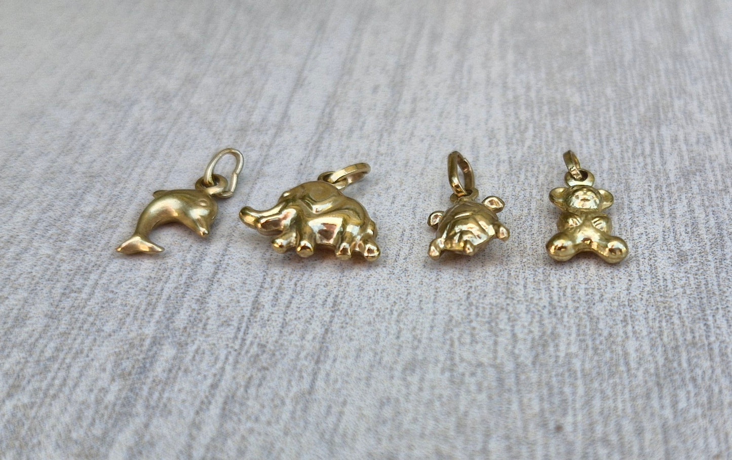 A Collection of 9ct Gold Charms