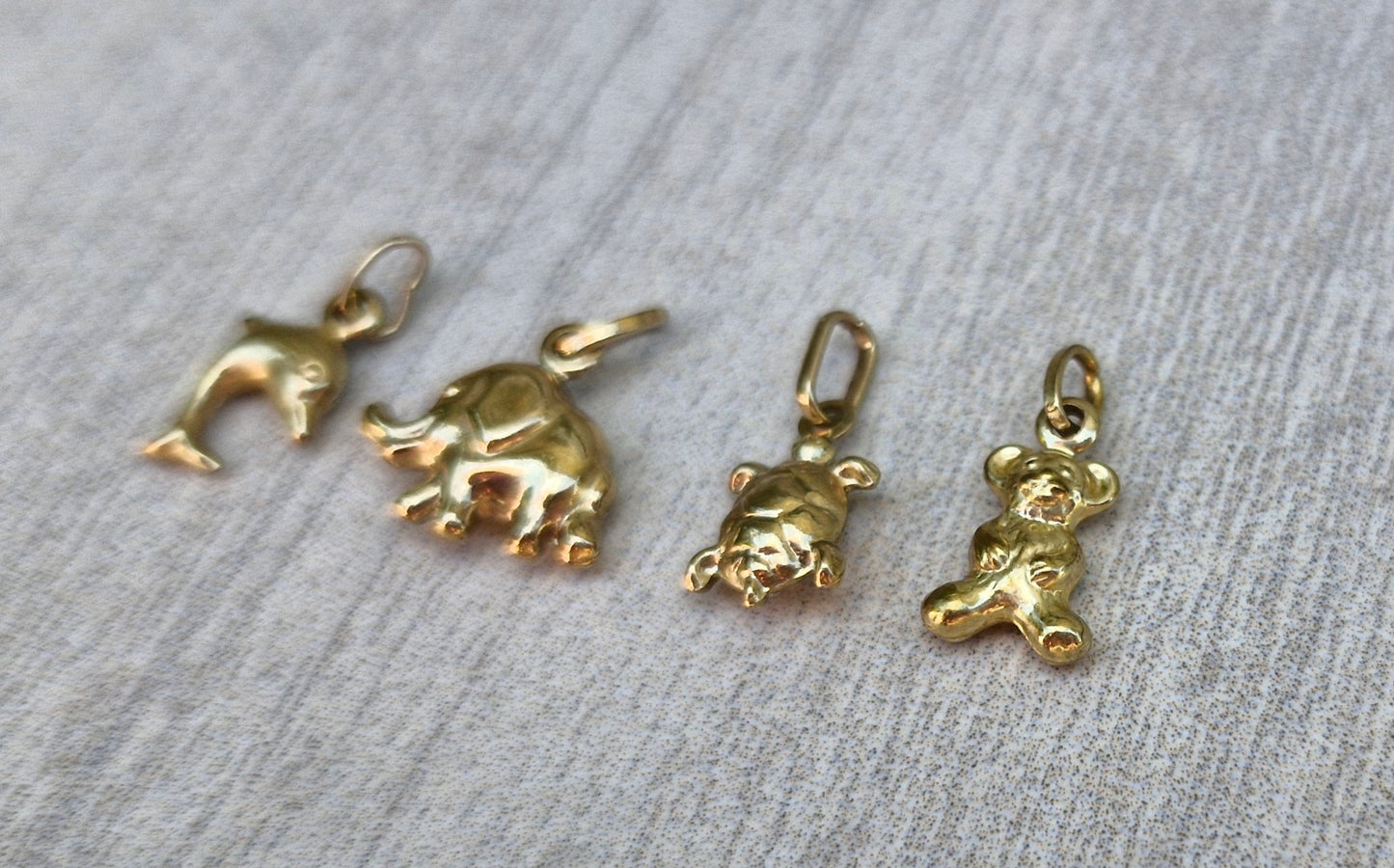 A Collection of 9ct Gold Charms